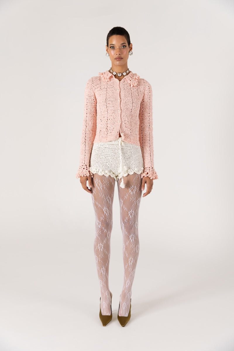 White handmade chrysanthemum crochet shorts by Andreeva featuring intricate floral patterns and a comfortable fit.