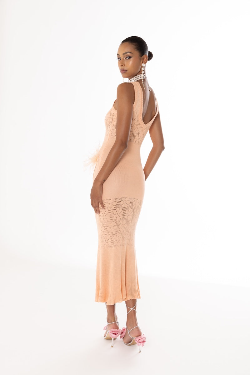 Andreeva vanilla peach knit midi dress with feather details, showcasing soft fabric and stylish design.