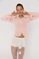 White handmade crochet shorts with chrysanthemum pattern by Andreeva, featuring intricate detailing and a comfortable fit.