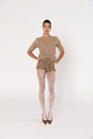 Brown handmade crochet shorts by Andreeva featuring intricate crochet patterns and a comfortable fit.
