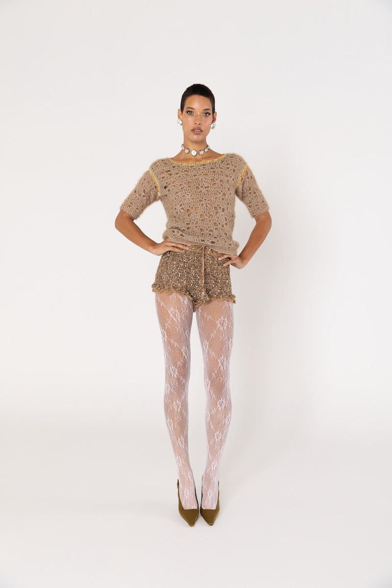 Brown handmade crochet shorts by Andreeva featuring intricate crochet patterns and a comfortable fit.