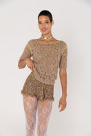 Brown handmade crochet shorts by Andreeva featuring intricate stitching and a relaxed fit, perfect for casual wear.