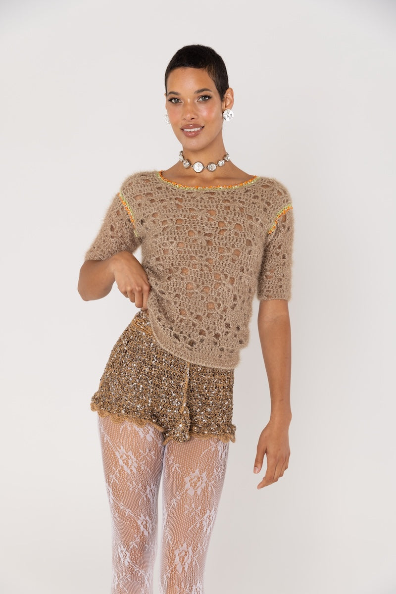 Brown handmade crochet shorts by Andreeva featuring intricate stitching and a relaxed fit, perfect for casual wear.