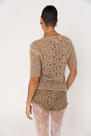 Brown handmade crochet shorts from Andreeva featuring intricate crochet patterns and a relaxed fit.