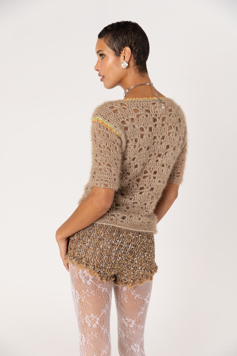 Handmade brown crochet shorts by Andreeva featuring intricate crochet pattern and a comfortable, stylish fit.