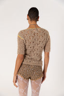 Brown handmade crochet shorts with chrysanthemum pattern from Andreeva, featuring intricate detailing and a comfortable fit.