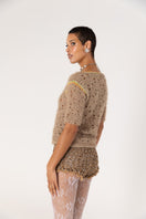 Brown handmade crochet shorts by Andreeva featuring intricate crochet patterns and a comfortable fit.