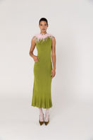 Green knit midi dress with pink feather details by Andreeva, featuring a stylish, textured fabric and elegant silhouette.