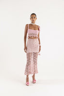 Pink vanilla handmade knit midi skirt by Andreeva, featuring a soft textured fabric and stylish midi length.