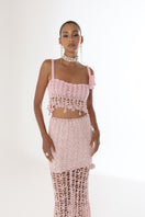Pink vanilla handmade knit midi skirt by Andreeva, featuring soft textured fabric and a stylish, flowy design.