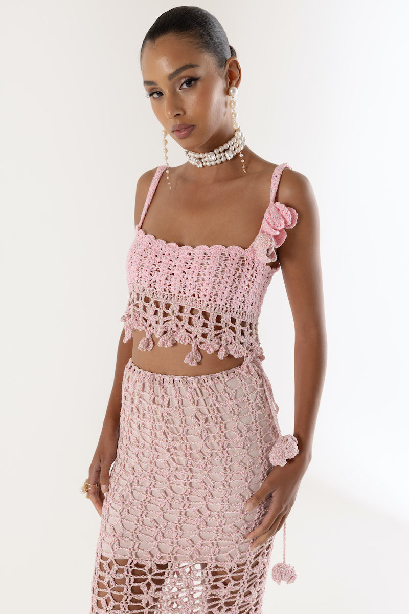 Pink vanilla handmade knit midi skirt by Andreeva, featuring soft texture and a flowy silhouette.