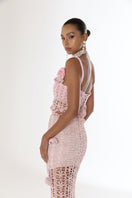 Pink vanilla handmade knit midi skirt by Andreeva featuring a soft, textured fabric and a stylish, flowy design.
