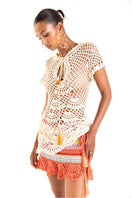Handmade crochet pearl top by Andreeva featuring intricate detailing and a stylish design, perfect for casual or dressy occasions.