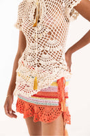 Handmade coral reef crochet mini skirt by Andreeva, featuring intricate coral-inspired pattern and a fitted waist.