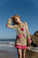 Multicolor handmade crochet mini skirt by Andreeva featuring intricate patterns and vibrant colors on a neutral background.