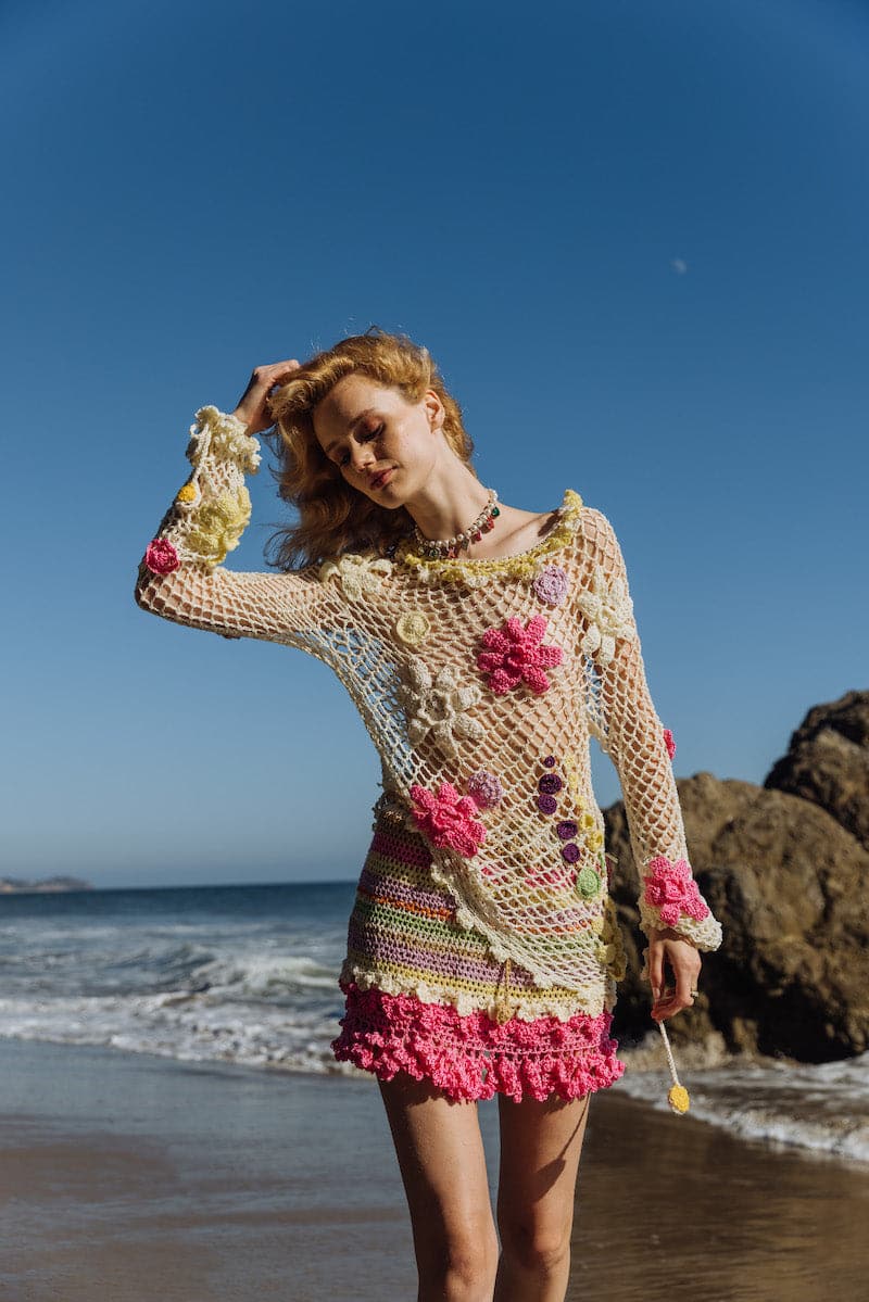 Multicolor handmade crochet mini skirt by Andreeva featuring intricate patterns and vibrant colors on a neutral background.