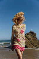 Colorful handmade mini crochet skirt by Andreeva featuring intricate multicolor patterns and a fitted waist.