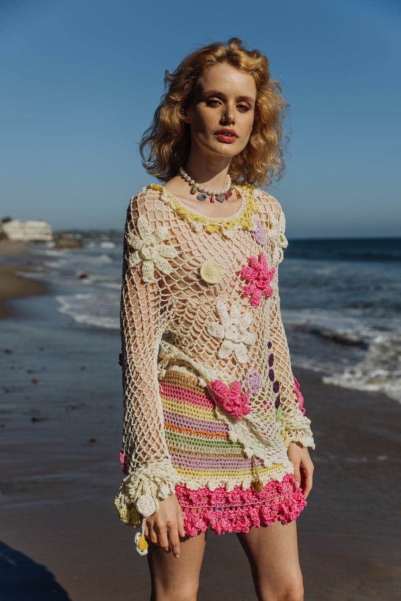 Multicolor handmade crochet mini skirt by Andreeva featuring intricate stitch details and vibrant multicolor pattern.