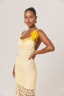 Yellow crochet midi dress by Andreeva featuring a handmade chrysanthemum design and a stylish, flowing silhouette.
