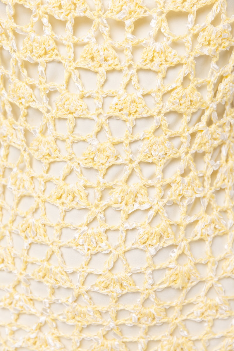 Yellow crochet midi dress from Andreeva featuring handmade chrysanthemum details and a fitted silhouette.