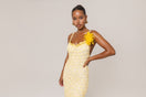Yellow crochet midi dress by Andreeva featuring handmade chrysanthemum embroidery and a flowing, elegant design.
