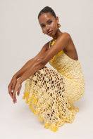 Yellow crochet midi dress by Andreeva featuring intricate handmade floral details, perfect for elegant occasions.