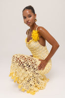 Yellow crochet midi dress by Andreeva featuring a handmade chrysanthemum pattern and a flowing, elegant design.