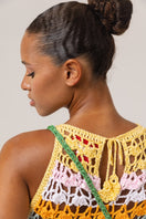 Handmade crochet mini bucket bag by Andreeva with top handle, featuring intricate crochet details and compact design.