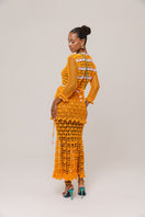 Orange handmade crochet shirt with California poppy pattern by Andreeva, featuring intricate crochet details and vibrant floral design.