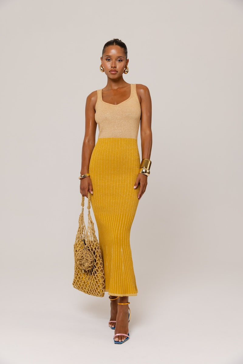 Golden Hour metallic knit maxi dress by Andreeva, featuring a shimmering gold finish and fitted silhouette.