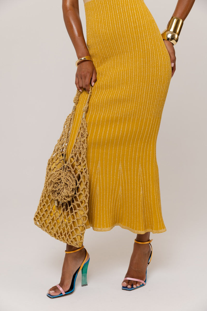 Golden Hour metallic knit maxi dress by Andreeva, featuring a shimmering gold finish and a flowing, elegant silhouette.