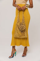 Golden Hour metallic knit maxi dress by Andreeva, featuring a shimmering gold finish and elegant fit.