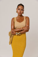Golden Hour metallic knit maxi dress by Andreeva, featuring a shimmering gold finish and a stylish, flowing silhouette.