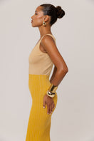 Golden Hour metallic knit maxi dress by Andreeva, featuring a shimmering gold finish and a flowing, elegant silhouette.