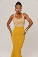 Golden Hour metallic knit maxi dress by Andreeva, featuring a shimmering gold finish and elegant long design.
