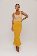 Golden Hour metallic knit maxi dress by Andreeva featuring a shimmering gold finish and a flowing, elegant silhouette.