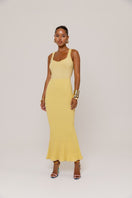 Yellow metallic knit maxi dress by Andreeva, featuring a fitted bodice and flowing skirt, perfect for stylish occasions.