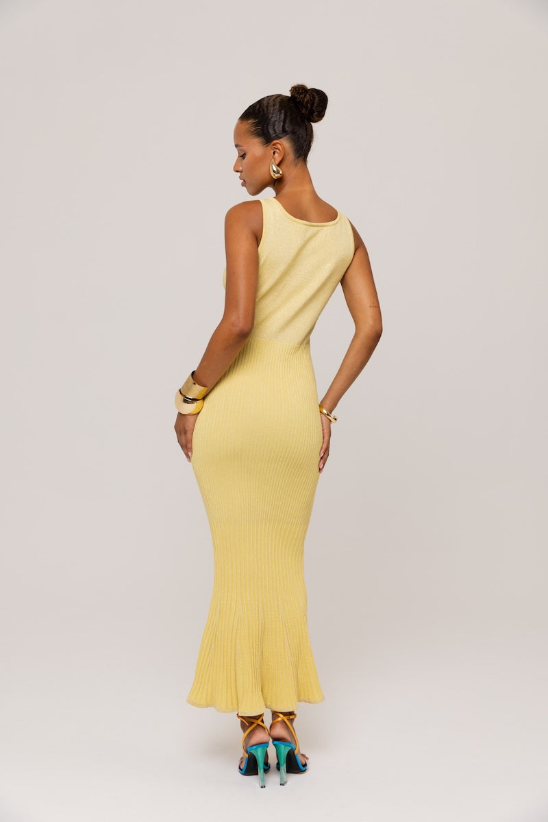 Yellow metallic knit maxi dress by Andreeva featuring a fitted silhouette and elegant, shimmering fabric.
