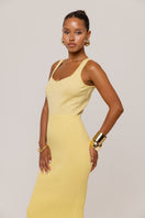 Yellow metallic knit maxi dress by Andreeva featuring a fitted silhouette and long sleeves.