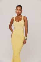 Yellow metallic knit maxi dress by Andreeva featuring a fitted bodice and flowing skirt, perfect for elegant occasions.