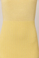 Yellow metallic knit maxi dress by Andreeva with a fitted silhouette and long sleeves, showcased in a full-length view.