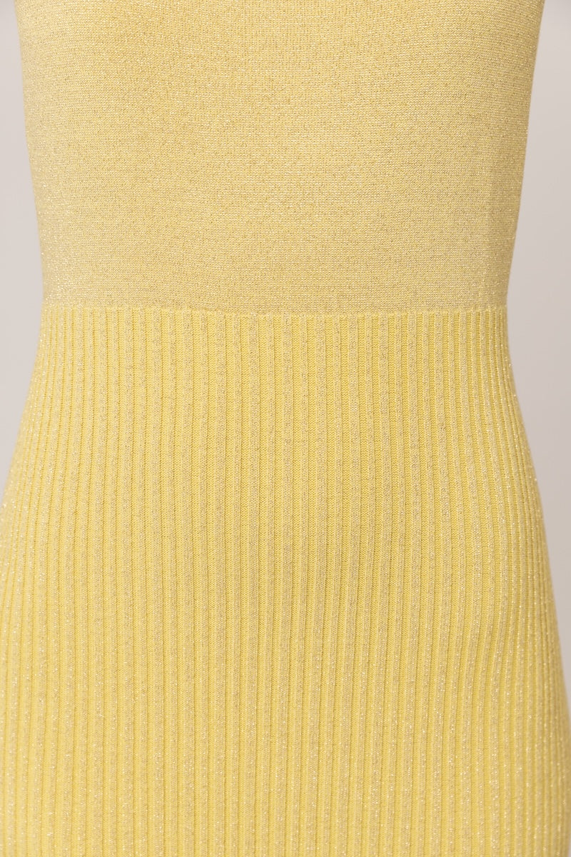 Yellow metallic knit maxi dress by Andreeva with a fitted silhouette and long sleeves, showcased in a full-length view.