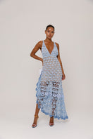 Handmade metallic iris crochet maxi dress by Andreeva, featuring intricate crochet details and flowing fabric in a shimmering finish.