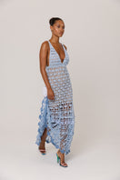 Handmade metallic iris crochet maxi dress by Andreeva featuring intricate crochet patterns and flowing fabric.