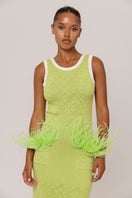 Green knit midi dress by Andreeva featuring a fitted silhouette and long sleeves, displayed on a hanger.