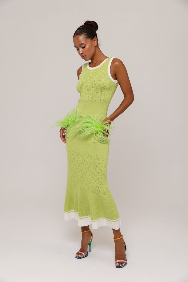 Green knit midi dress by Andreeva featuring a fitted silhouette and ribbed texture, perfect for casual or semi-formal wear.