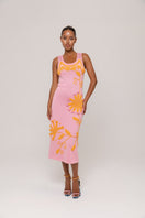 Andreeva golden daisy knit midi dress with handmade embroidery, showcasing detailed floral patterns and a fitted silhouette.