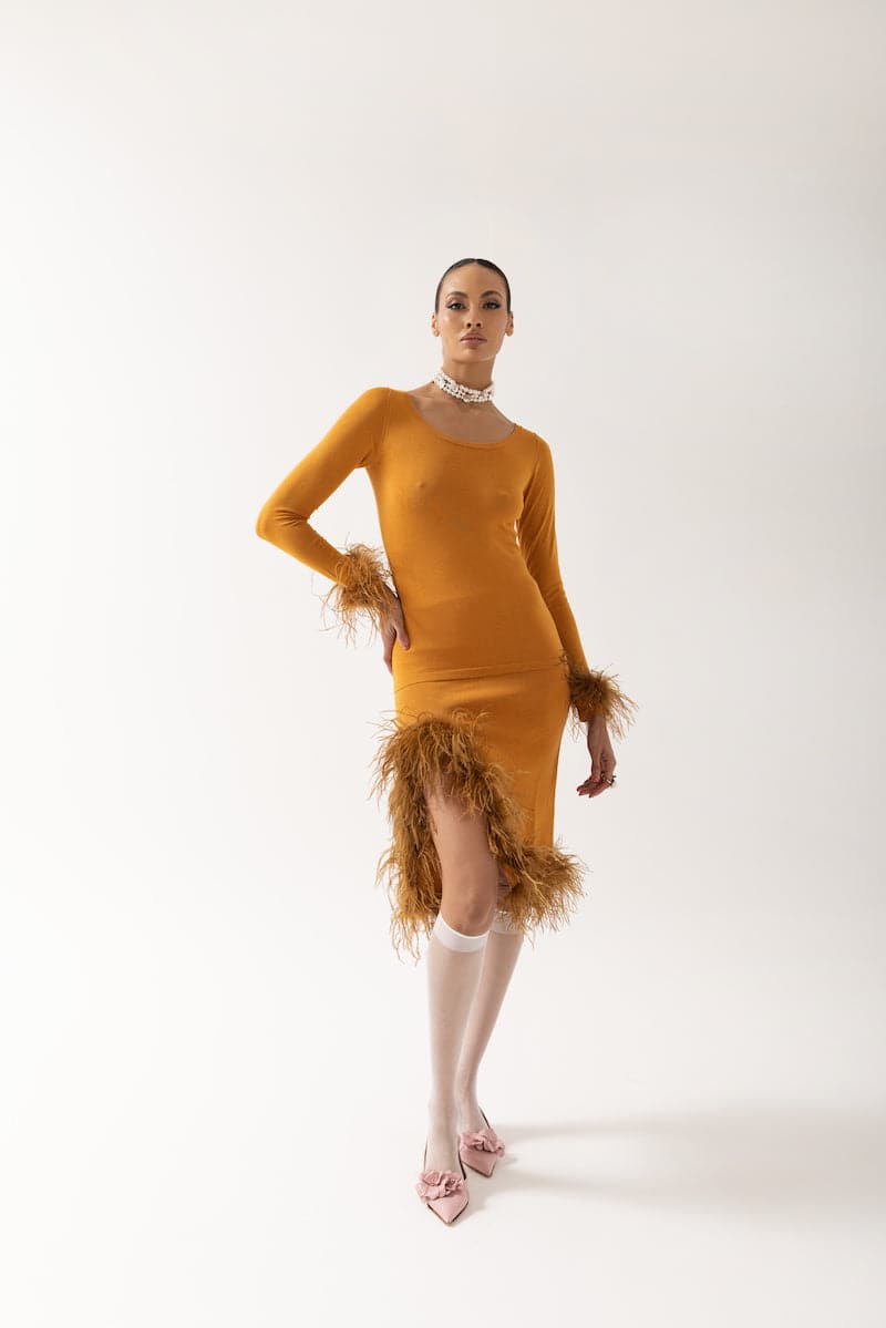 Andreeva camel knit top with stylish feather cuffs, featuring a cozy fit and fashionable design.