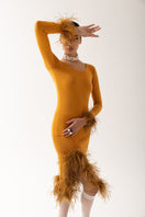 Andreeva camel knit top with detachable feather cuffs, featuring a cozy fit and stylish details, shown on a model.