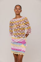 Handmade crochet top by Andreeva featuring a vibrant pink and yellow bird of paradise design, casual and stylish for warm weather.